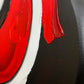 Abstract, acrylic and mixed-media painting close-up of the texture paste, red, black, grey, and white acrylic paint on round canvas focusing on the beautiful curved-edges 4