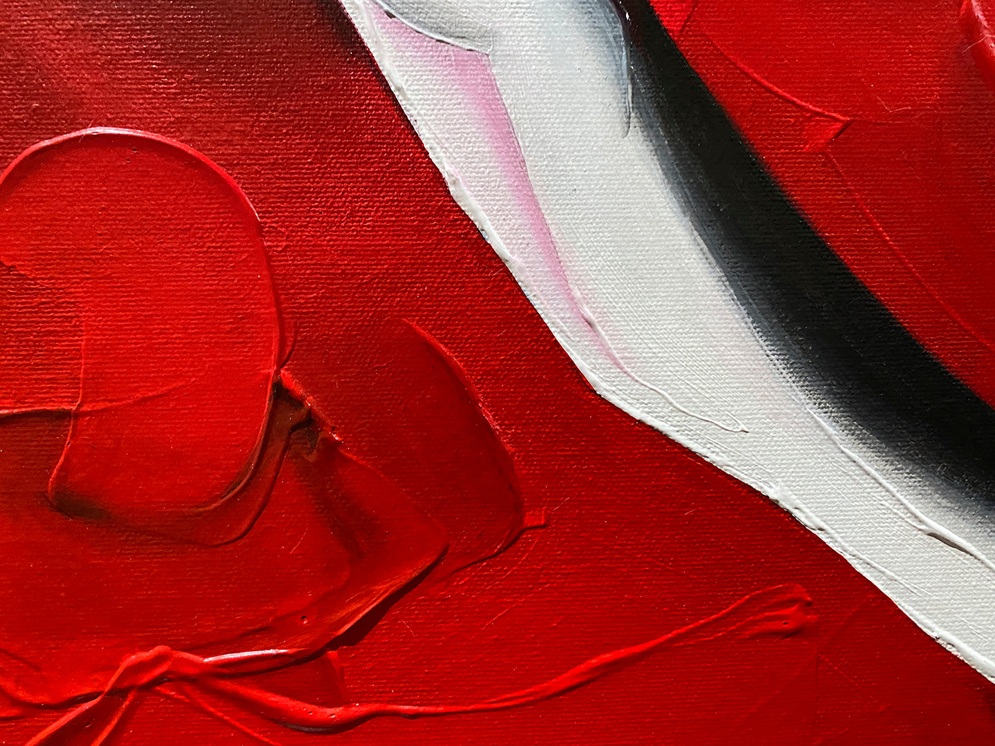 Abstract, acrylic and mixed-media painting close-up 1. texture paste, red, black, grey, and white acrylic paint on round canvas with curved-edges.