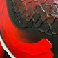 Abstract, acrylic and mixed-media painting close-up of the texture paste, red, black, grey, and white acrylic paint on round canvas focusing on the beautiful curved-edges 2