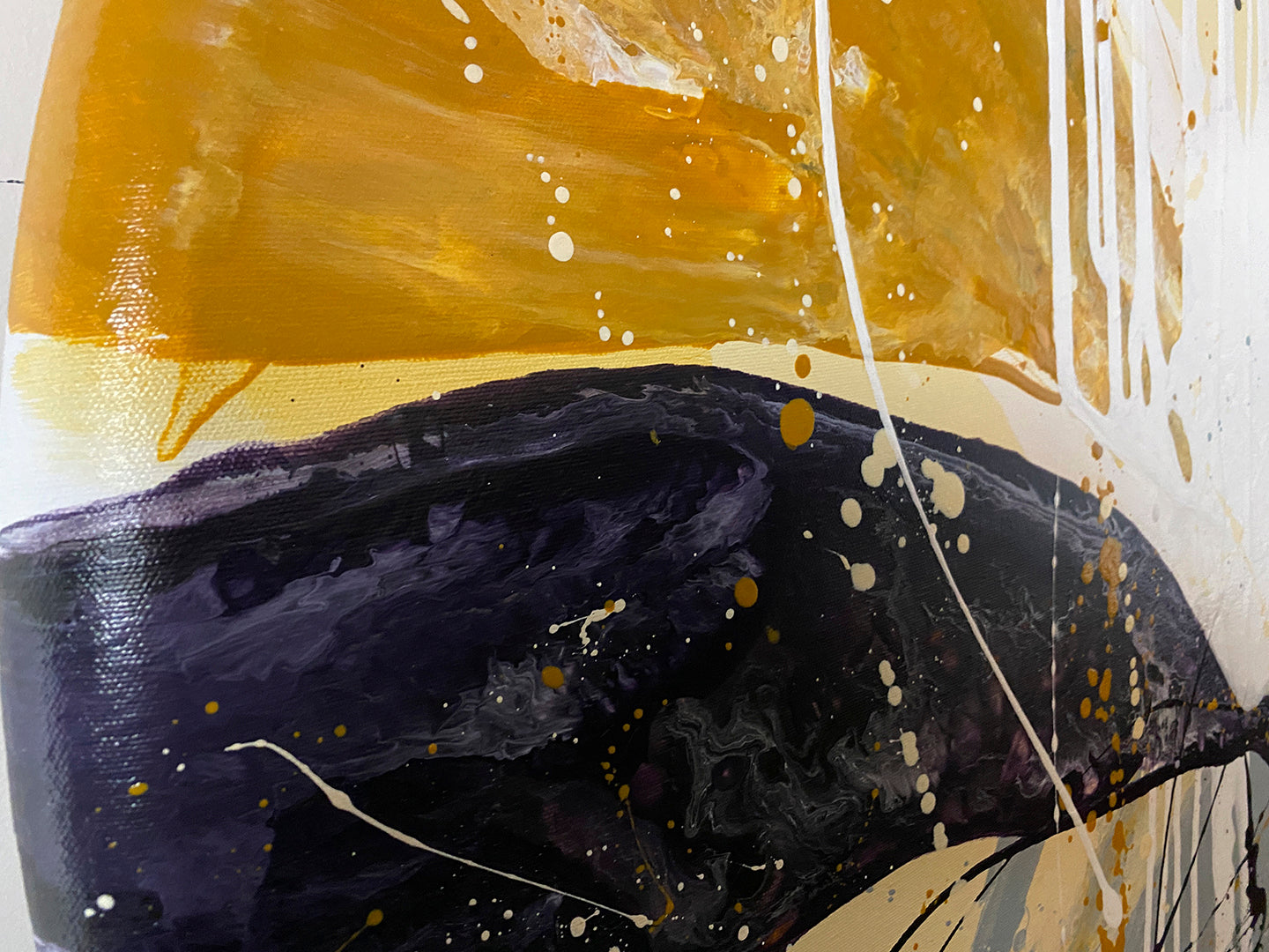 Abstract acrylic painting close-up 1 showing curved-edge of canvase: gold, yellows, phthalo-blue, purple-grey and white