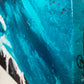 Abstract, expressionism, acrylic painting close-up showing signature on the canvas edge. Volatile interactions of black, dark blue, turquoise, bright red and white