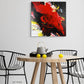 Abstract, expressionism, acrylic 24” giclee print: tumultuous explosion of bright red, black, yellow and white on a pale grey wall over a dining room table and chairs.