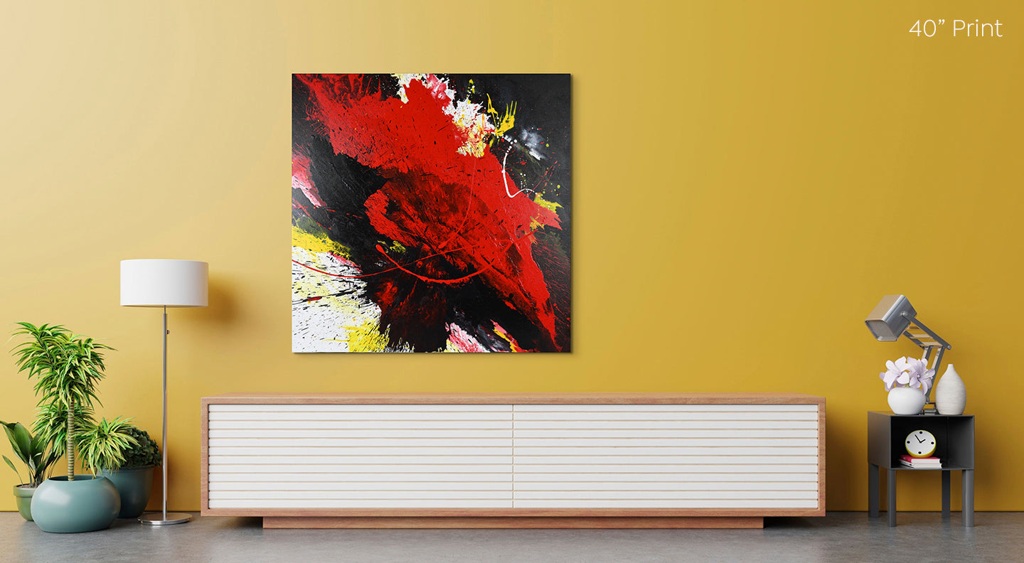 Abstract, expressionism, acrylic 40” giclee print: tumultuous explosion of bright red, black, yellow and white on a yellow wall in a retro modern living room over a long low sideboard.