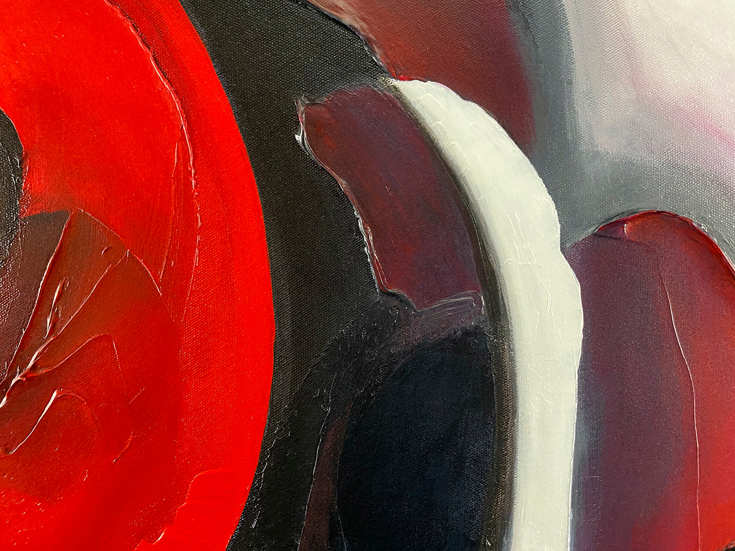 Abstract, acrylic and mixed-media painting close-up 1. texture paste, red, black, grey, and white acrylic paint on round canvas with curved-edges