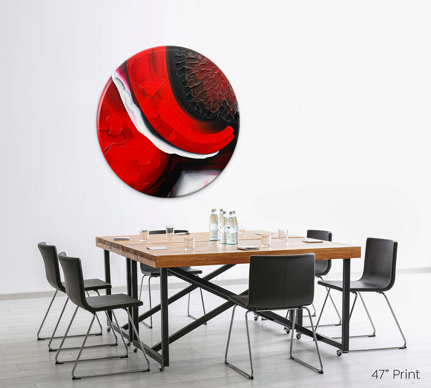 Abstract, acrylic and mixed-media 47” print on a round canvas with curved-edges shown on a white wall above a dining room table