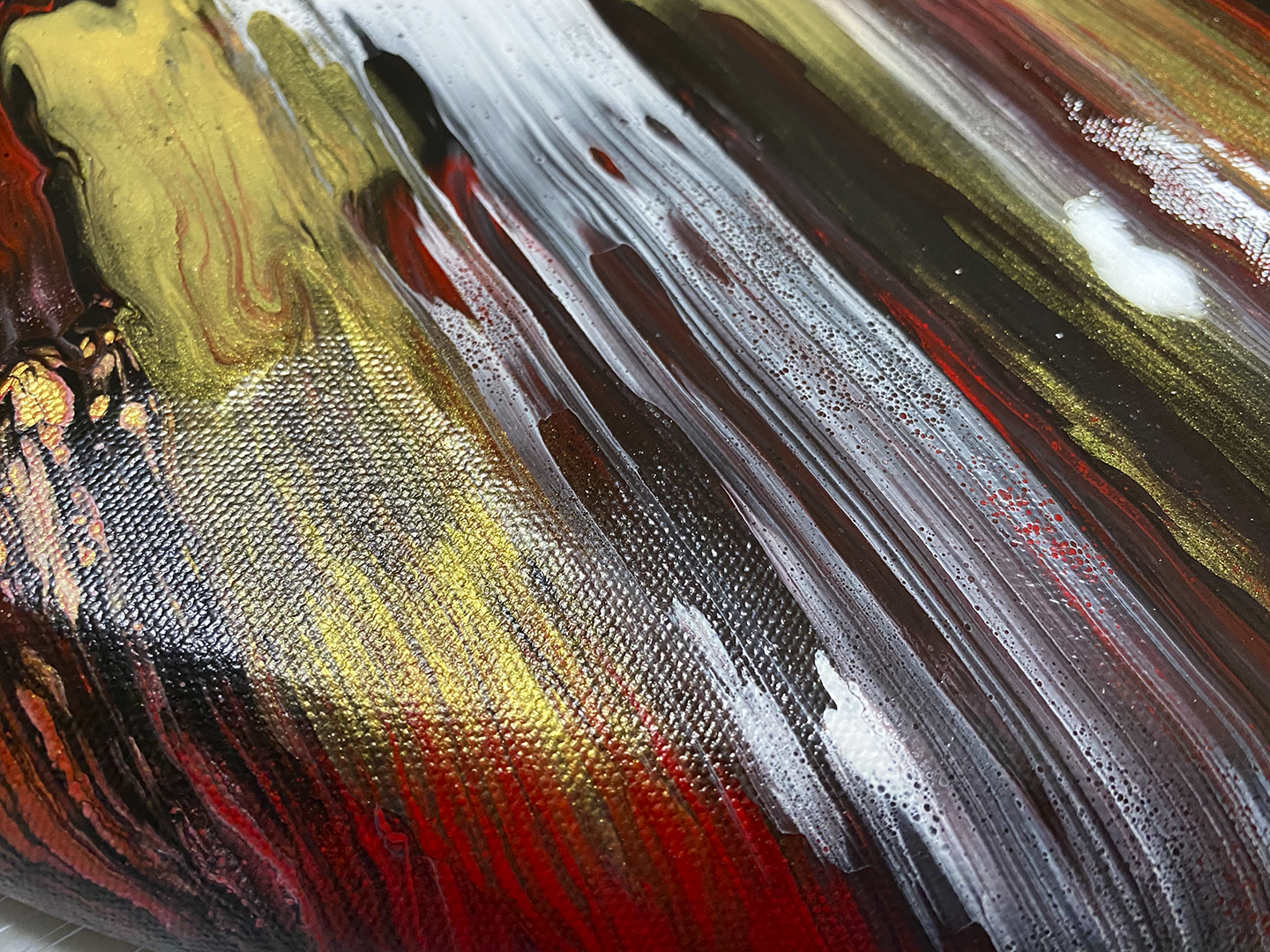 Abstract, acrylic and mixed-media painting close-up 2. Texture paste, gold foil with black, red, white and gold acrylic paint on round canvas with curved-edges