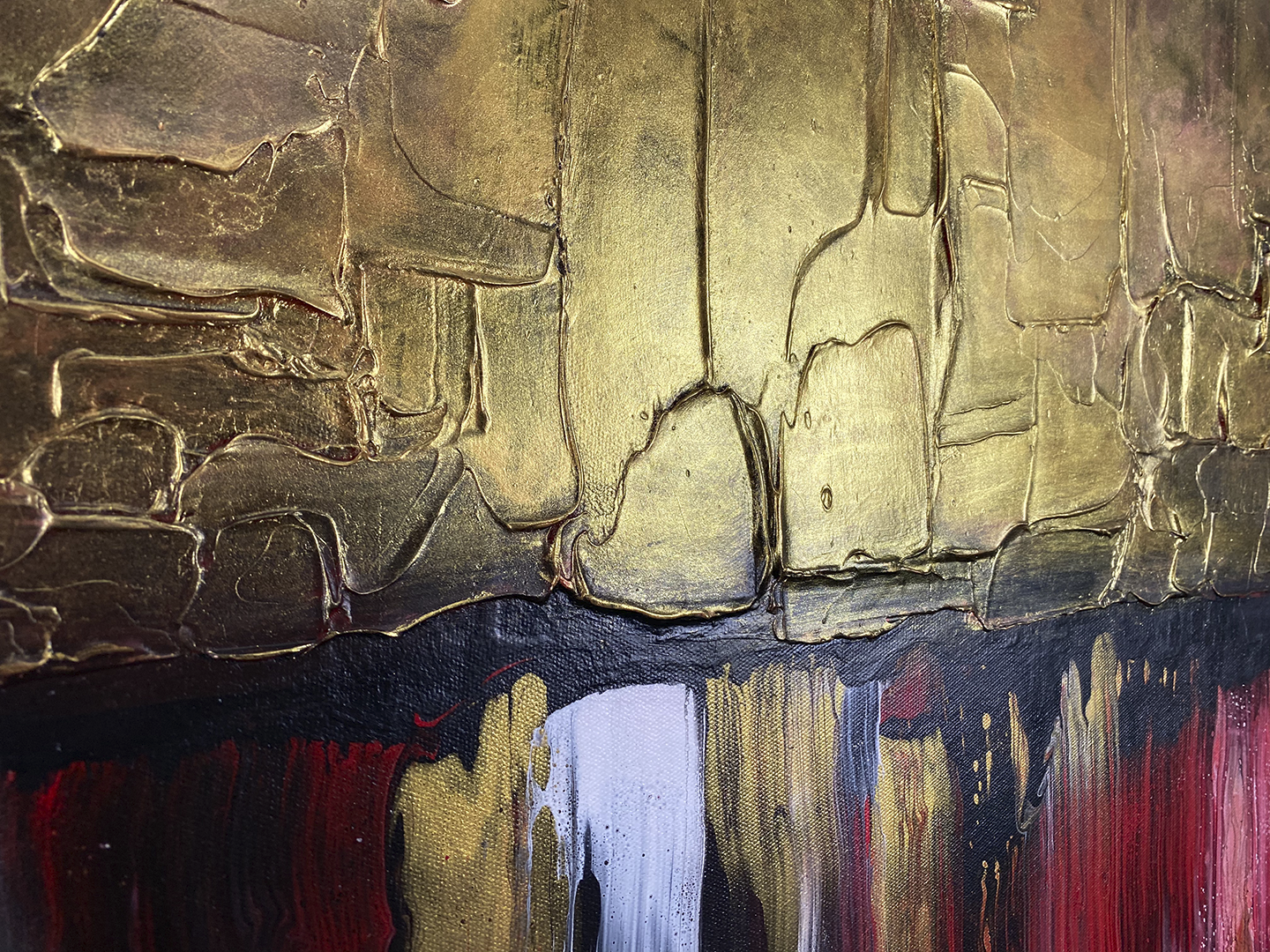 Abstract, acrylic and mixed-media painting showing a close-up of the texture paste and gold foil  And the black, red, white and gold acrylic paint